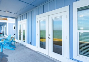 Sweeping views of Copano Bay from this newly constructed ground floor condo with a pool and a new fishing pier!