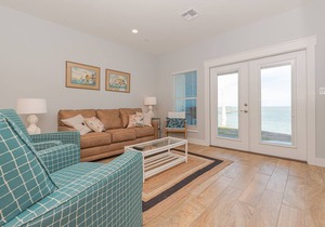 Sweeping views of Copano Bay from this newly constructed ground floor condo with a pool and a new fishing pier!