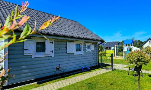 Postomino House | Święty Spokój Rusinowo- domki nad morzem z własnymi ogródkami