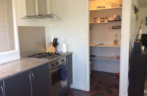 Rangiputa House | 1 minute flat walk to beach and ramp. Open plan lounge,dining room & kitchen.