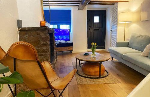Upholland House | 1750's cottage with open fire and beams