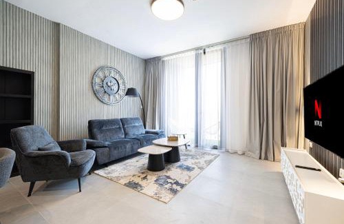 Sharjah Apartment | 1BR The Modern Al Jada Home by Blue Cloud Holidays
