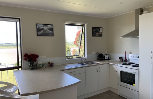 Te Kopuru House | 2 Adjoining riverfront homes, spa, allow kids & pets, sleeps 14