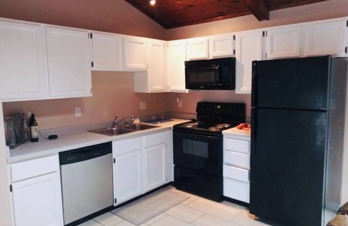 Lexington House | 2 bedroom , 2 bath townhome , cabin vibe! Vaulted ceiling with a skylight view!