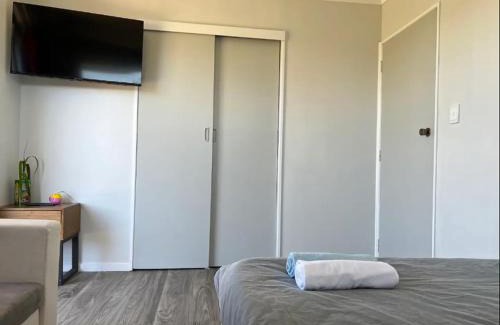 Kawaha Point Apartment | 2 Double Beds, 1 Single Bed, 1 Double Sofa Bed in a small 1 bedroom and 1 lounge Studio No Kitchen Only fridge, microwave