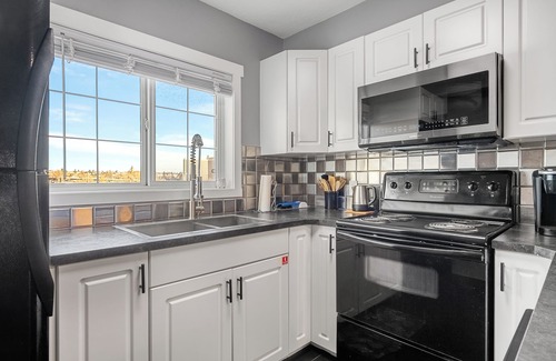 East Village Condo | 3-Bed by River, AC, Free Parking, Near Saddledome