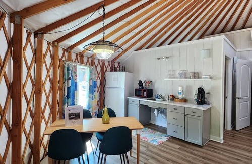 Mill Spring House | 30' ADA Yurt with a large deck, on the creek, full kitchen, dome skylight, dog friendly, 2 bedrooms, sleeps 5.