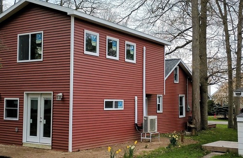 Tawas City House | 4 bedroom home, View and Access to Lake Tawas. Kayaks. Sleeps 9. King Bed.