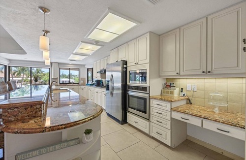 Saint Armands Key House | 4 BR/3 BA Lido Canal Home by FVC