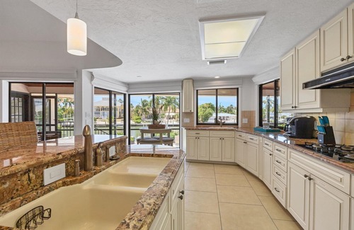 Saint Armands Key House | 4 BR/3 BA Lido Canal Home by FVC