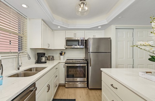 Fort Myers Beach Condo | 406 Estero Island 2BR: Ocean Views, Pool & BBQ Area