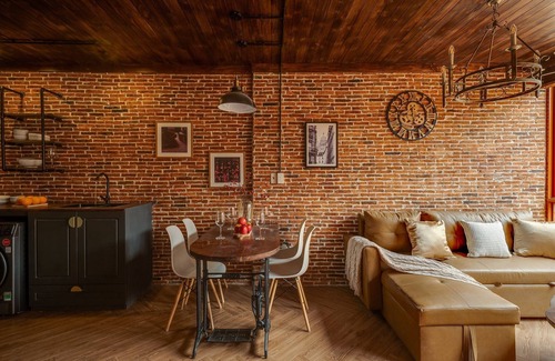 Downtown Ho Chi Minh City House | 4BR Industrial Gem with Rooftop Garden by Bến Thành