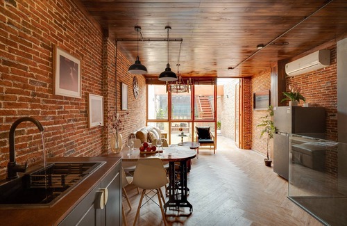 Downtown Ho Chi Minh City House | 4BR Industrial Gem with Rooftop Garden by Bến Thành