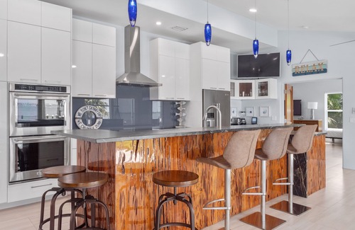 Fort Pierce House | 5BR/4.5B Beach House- heated pool, deep water dock, walk to beach!