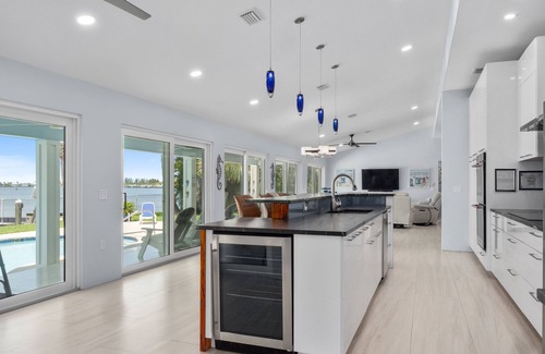 Fort Pierce House | 5BR/4.5B Beach House- heated pool, deep water dock, walk to beach!