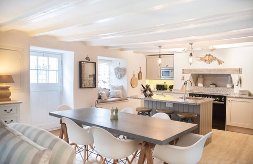Malborough Cottage | A renovated 300 year old Thatched cottage in the heart of a pretty village.