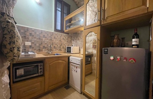 Damour House | A renovated historic rock house with two vaults