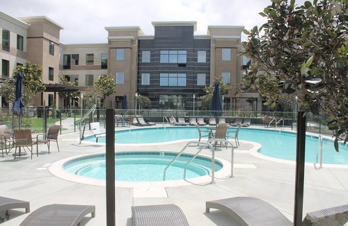 Bressi Ranch Condo | Accessible King Suite Near the Airport | Free Breakfast, Gym + Pool Access