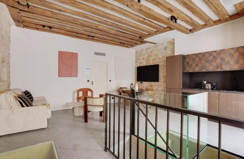 Marais Apartment | Air-Conditioned Duplex Place des Vosges: Comfort Meets Classic Paris