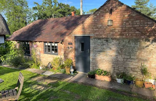 Moreton Cottage | An Original Bakehouse located in the grounds of a 18th century thatched cottage
