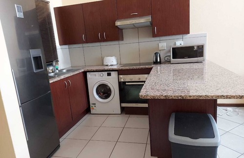 Greater Johannesburg Metropolitan Area Apartment | Apartment with Lush green garden and a Pool