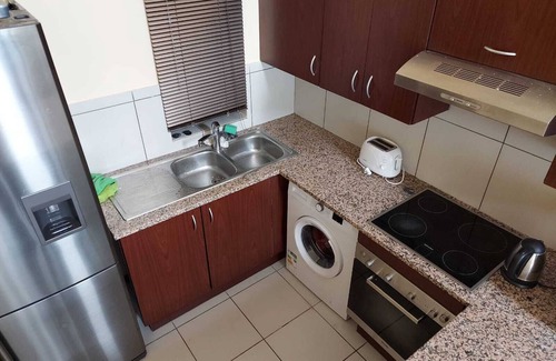 Greater Johannesburg Metropolitan Area Apartment | Apartment with Lush green garden and a Pool