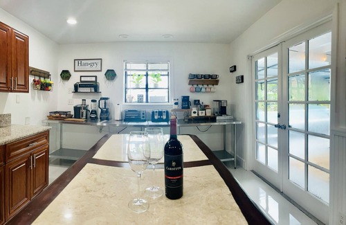 West Palm Beach House | Artsy, water-views, heated pool, tiki, 4Bdrom, 3Bth, Sleeps 10
