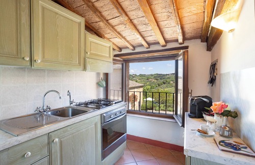 Siena House | Attic room with exposed beams, rustic Tuscan style