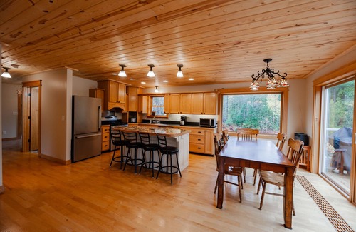 Champion House | ATV-Snowmobile Trail, Large home, sits on the peshekee river. sleeps 22 people.