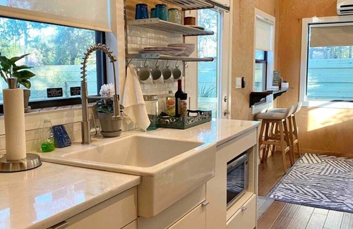 Southeast Pensacola House | Awesome Tiny Home with Stock Tank Pool Near Downtown Pensacola