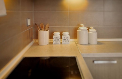 Skala Sotiros Apartment | Balconies on the sea - the garden apartment