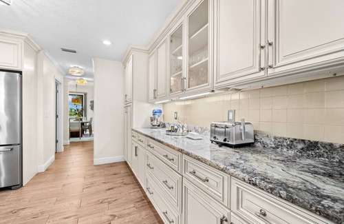 Bayshore Gardens House | Bayfront estate with heated pool, private beach, dock & incredible sunsets