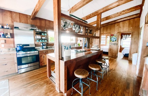 Alligator Point House | BEACH FRONT to BAY with boatdock, swimming pool, pickleball courts and kayaks.