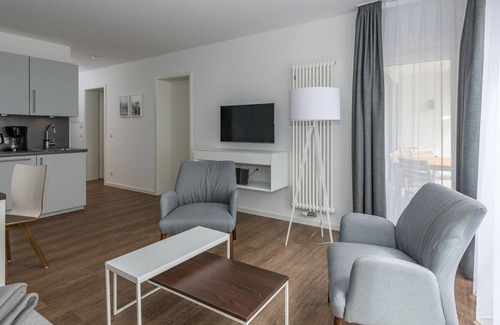 Bensersiel Apartment | Beachfront apartment with large balcony, parking, use of swimming pool & sauna -
