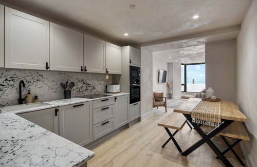 Mumbles Apartment | Beachfront eco-friendly apartment with ocean view and modern interior sleeping up to 6