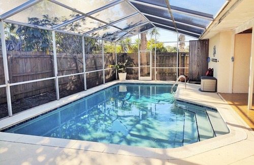 Villa De Palmas House | Beautiful Beach Style Home by Port Canaveral w/Private Salt Water pool