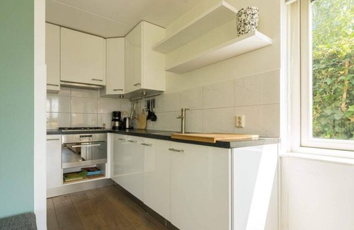 Oude-Tonge House | Beautiful home with roof terrace and a view of the water.