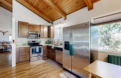 Groveland House | Beautiful home with wraparound deck, fireplace, and pool access