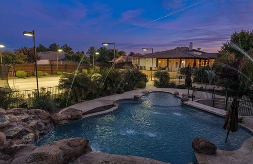 Gilbert House | Beautiful oasis with pool, pickleball courts, putting green, 13’ theatre screen