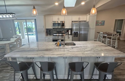 Pebble Beach House | Beautifully updated waterfront 3-bedroom house with heated pool in Rotonda West.