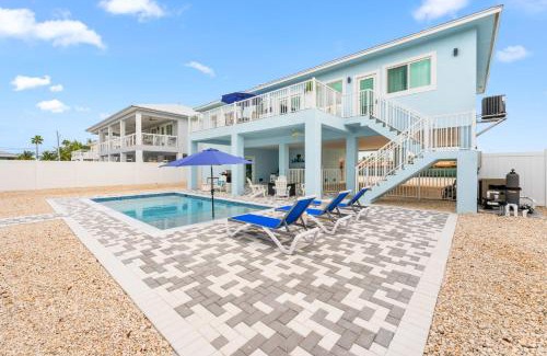 Marathon Villa | Blue Pearl New Waterfront Haven with Heated Pool ,70 Foot Dock, and More!