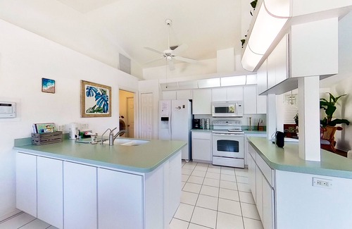 Pebble Beach House | Bohemian canal-front retreat with pool, beach gear, adult bikes, & AC - dogs ok