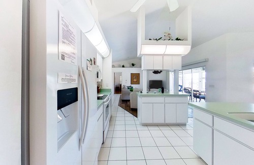 Pebble Beach House | Bohemian canal-front retreat with pool, beach gear, adult bikes, & AC - dogs ok