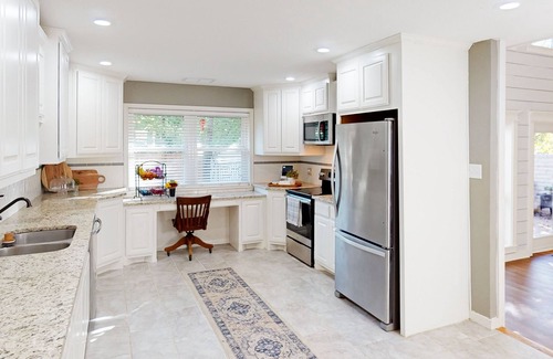 Abilene House | Bohemian home with an enclosed patio, high ceilings, & board games