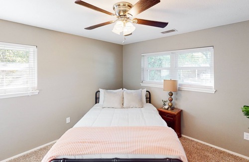 Abilene House | Bohemian home with an enclosed patio, high ceilings, & board games