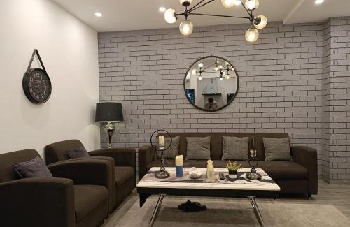Bahria Town Apartment | Brick Accent Loft 1BHK with Balcony & Free Netflix