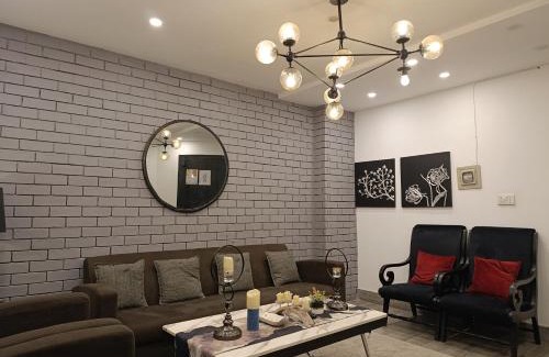 Bahria Town Apartment | Brick Accent Loft 1BHK with Balcony & Free Netflix