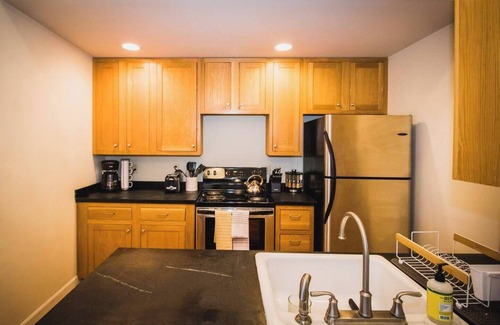 Greeley Apartment | Brick & Balcony Greeley Retreat