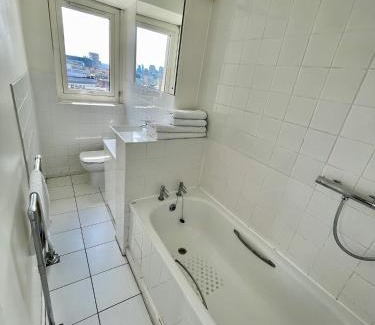 Soho Apartment | Bright 2-Bedroom in Soho High-Rise with Skyline Views