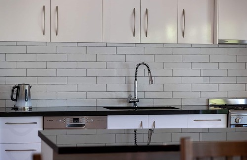 Wandiligong House | *BRIGHT* Modern Home with large outdoor deck and outside fireplace.